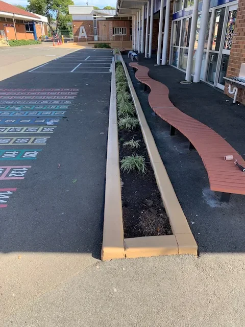Concrete sealing at a Cabramatta school including playground planters, ramps and entrance stairs