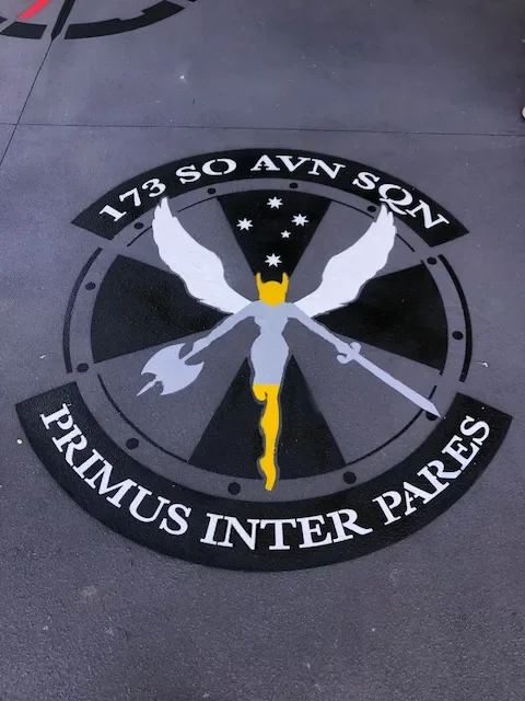173 Special Operations Aviation Squadron circular insignia stencil on a hangar floor