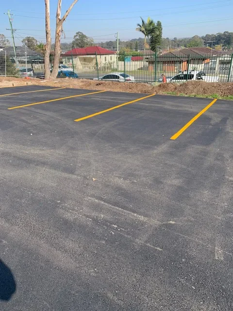 Yellow parking bay lines on a school car park