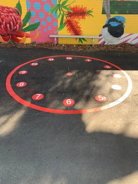 Large playground clock face with numbered hours for telling-the-time activities in Mittagong
