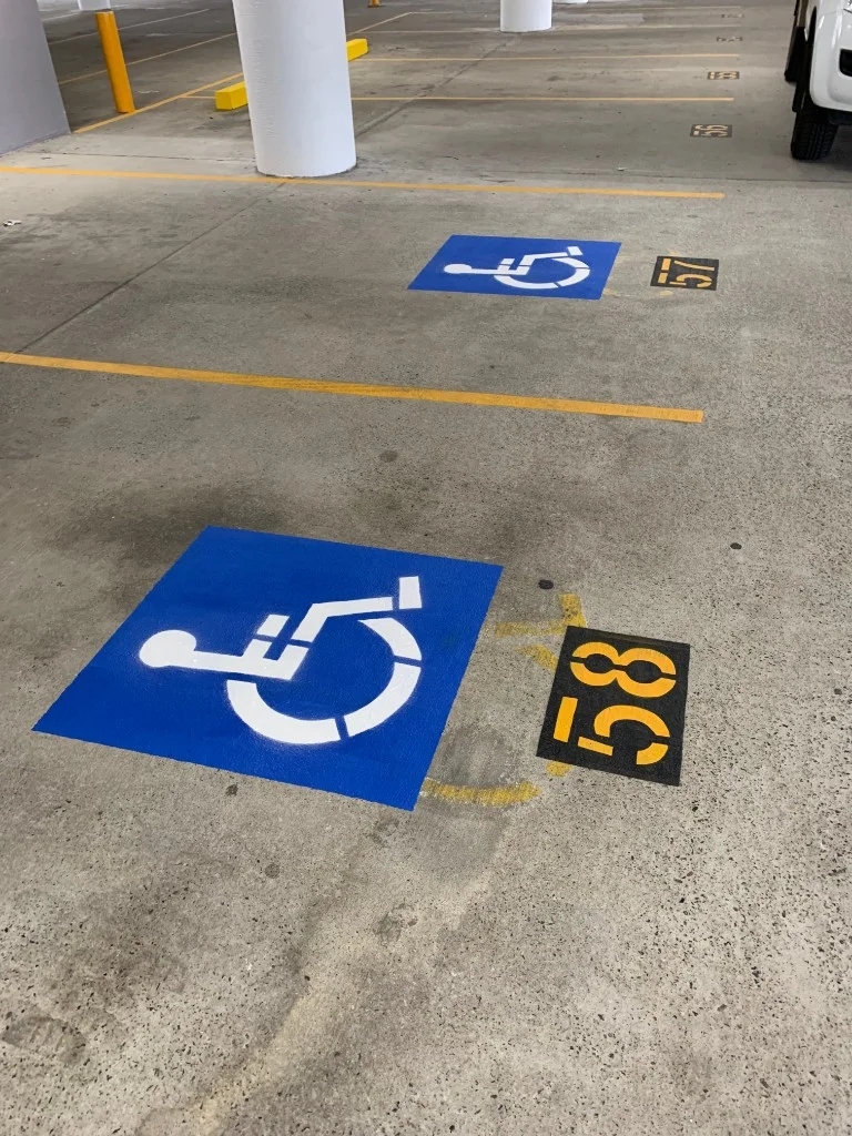 Numbered disabled parking bays in a shopping centre car park